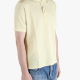 Tan shirt worn by a person, showing the fit