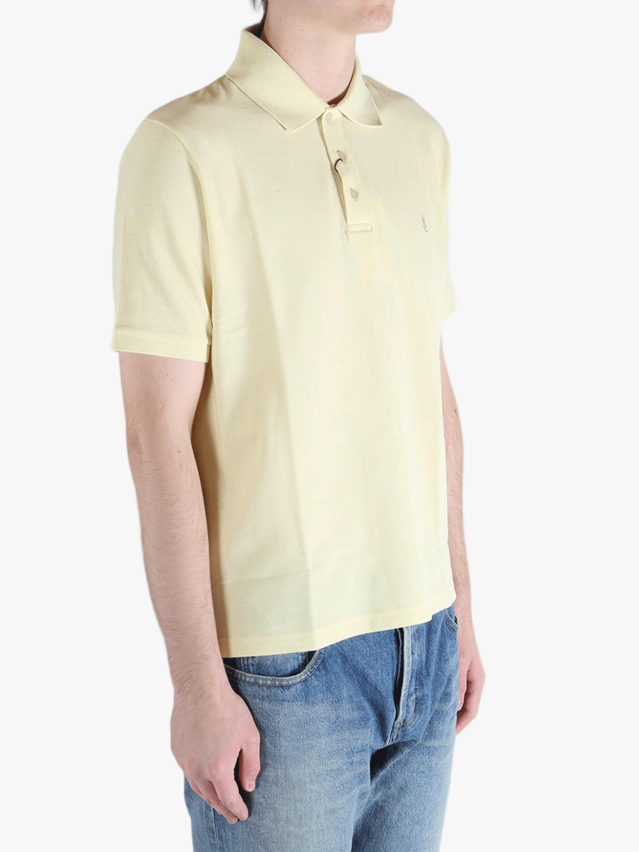Tan shirt worn by a person, showing the fit