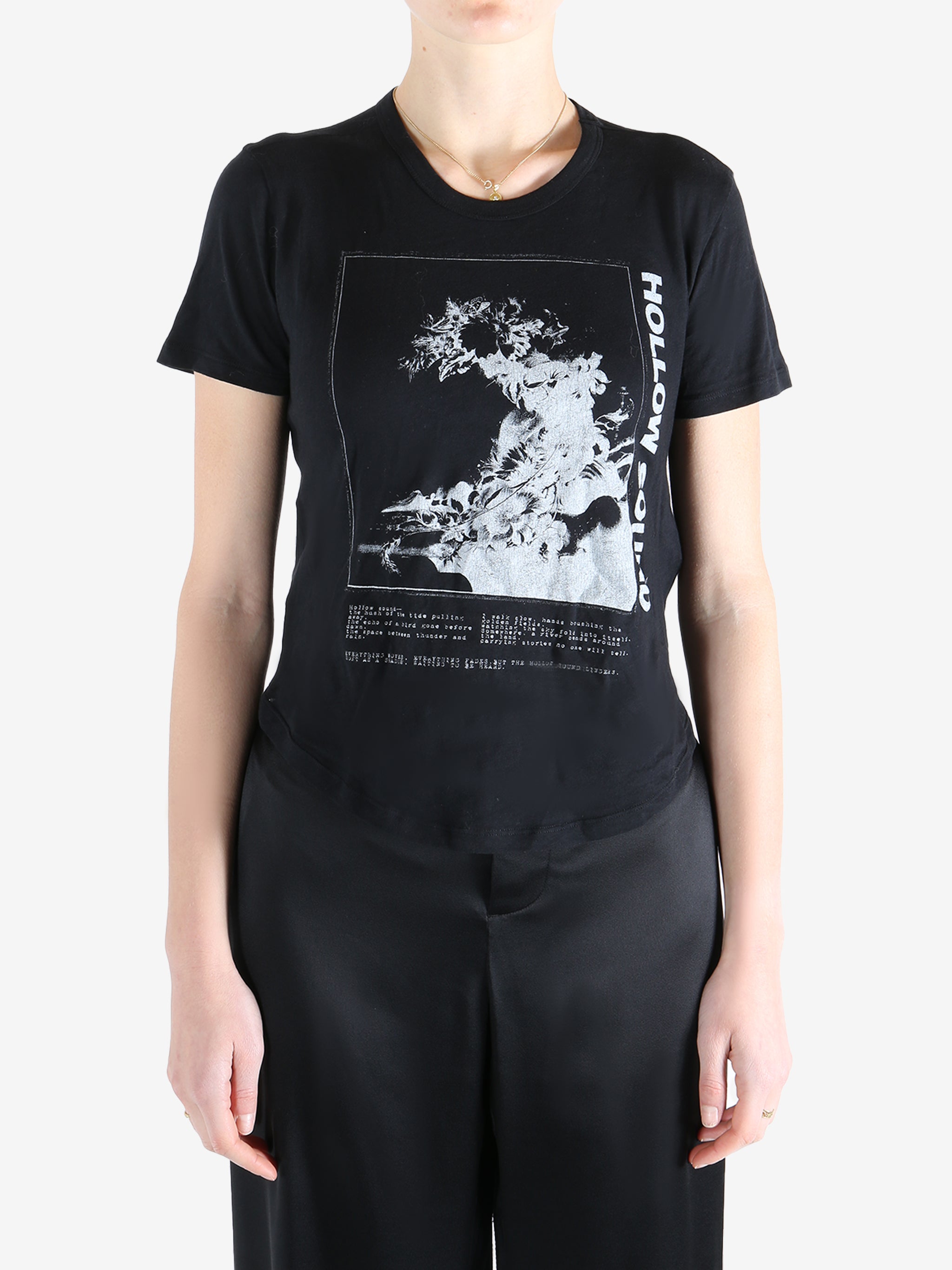 Black t-shirt worn by a person, showing the shirt's fit