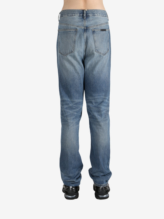 Blue jeans worn by a person, showing the jeans's fit