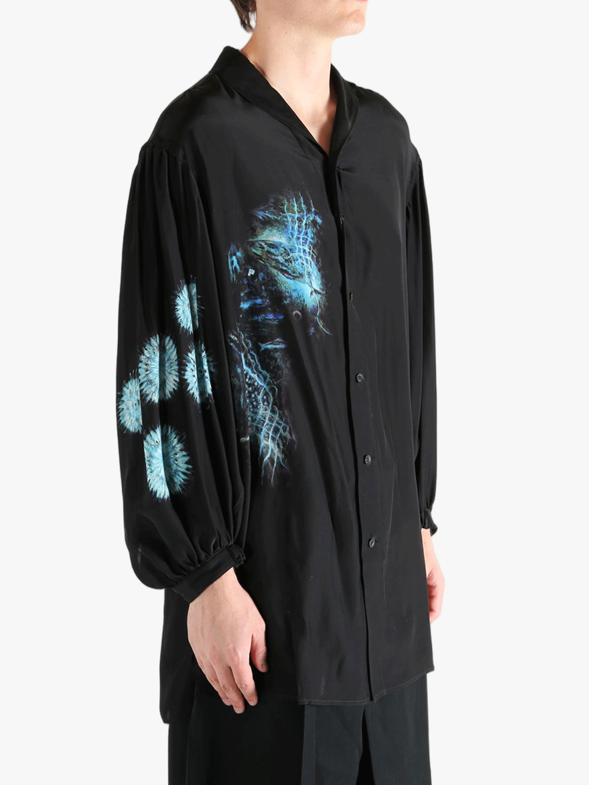 Black shirt worn by a person, showing the shirt's fit