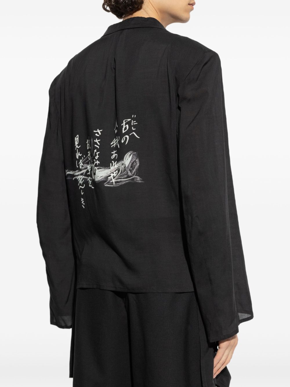 Black jacket worn by a person, showing the jacket's fit