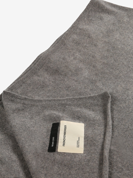 Close up of the brown blanket, showing texture of the fabric