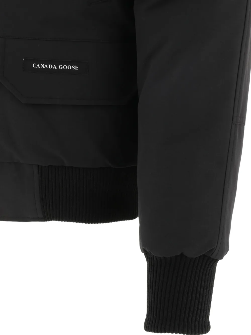 Close up of black jackests-coats, showing texture of the polyester fabric