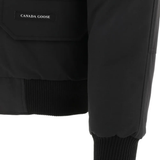 Close up of black jackests-coats, showing texture of the polyester fabric