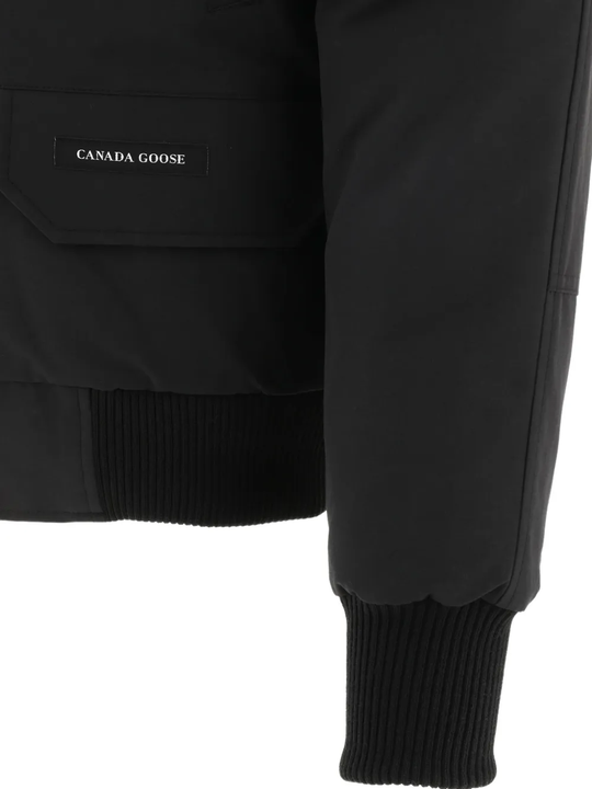 Close up of black jackests-coats, showing texture of the polyester fabric