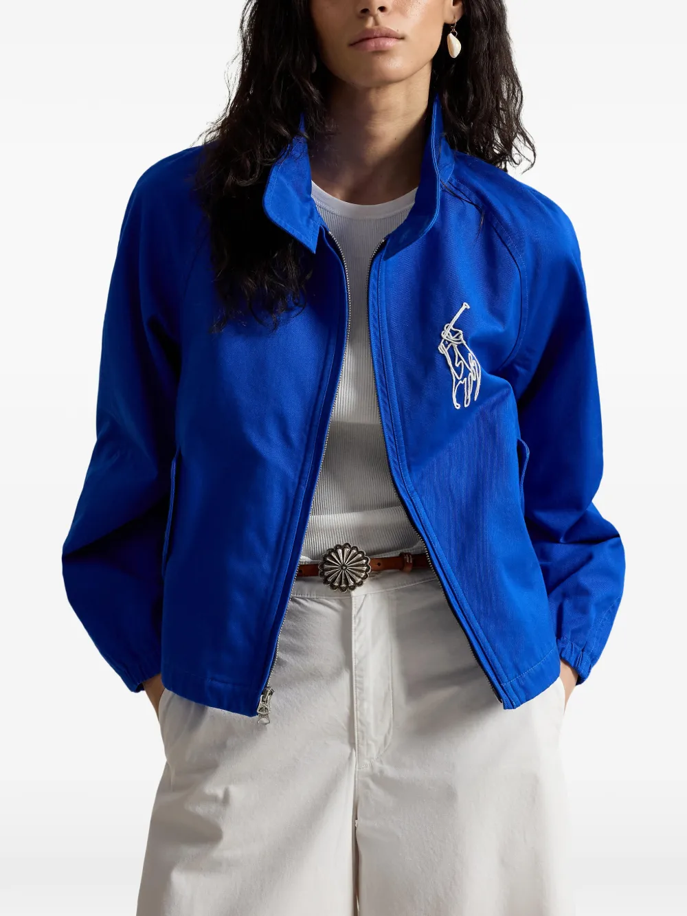 Blue jacket worn by a person, showing the jacket fit