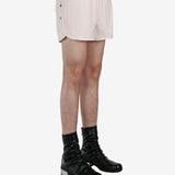 White short worn by a person, showing the short fit