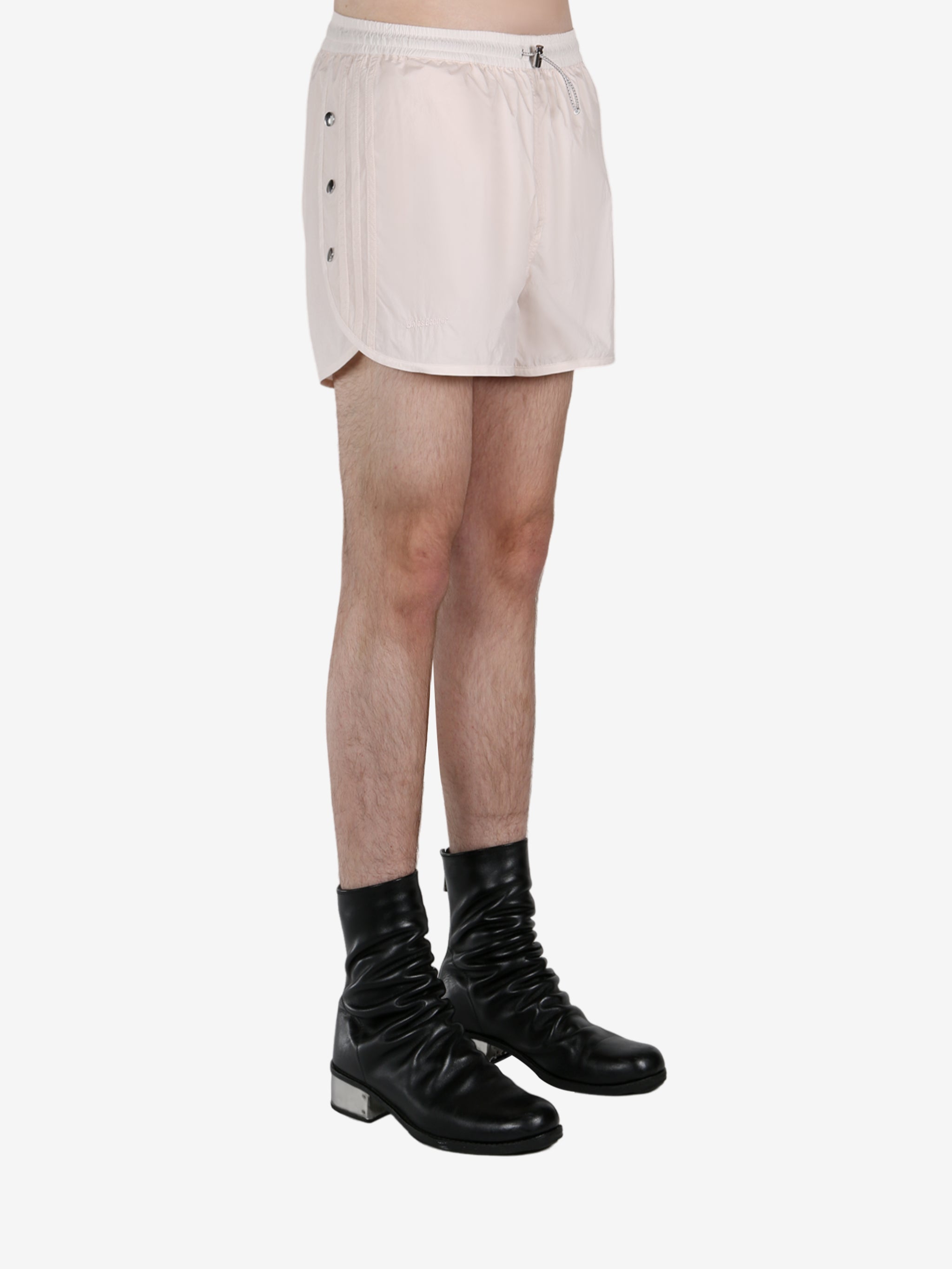 White short worn by a person, showing the short fit