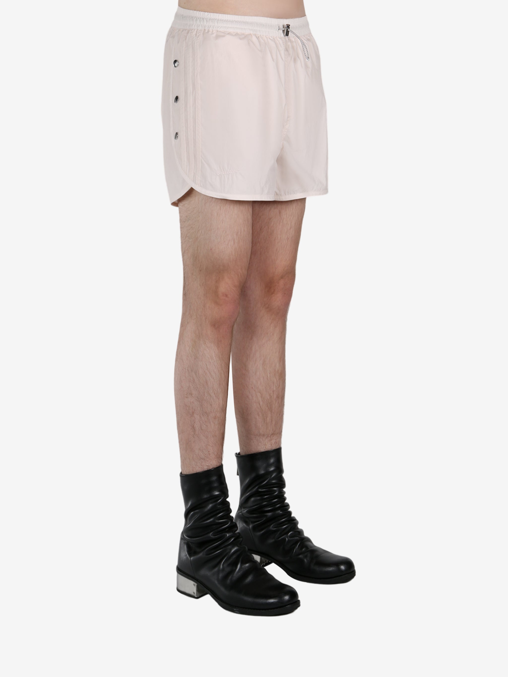 White short worn by a person, showing the short fit