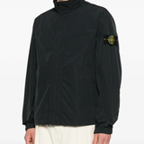 Black jacket worn by a person, showing the jacket fit