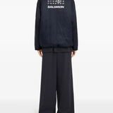 Blue jackets worn by a person, showing the jackets fit