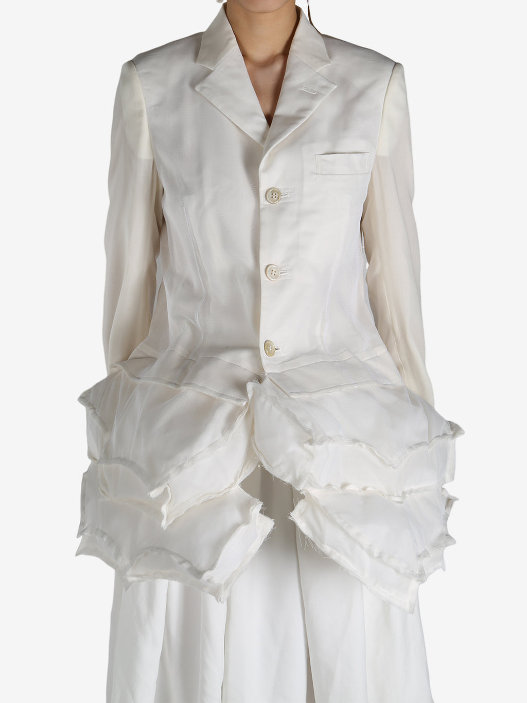 White jackets worn by a person, showing the jackets fit