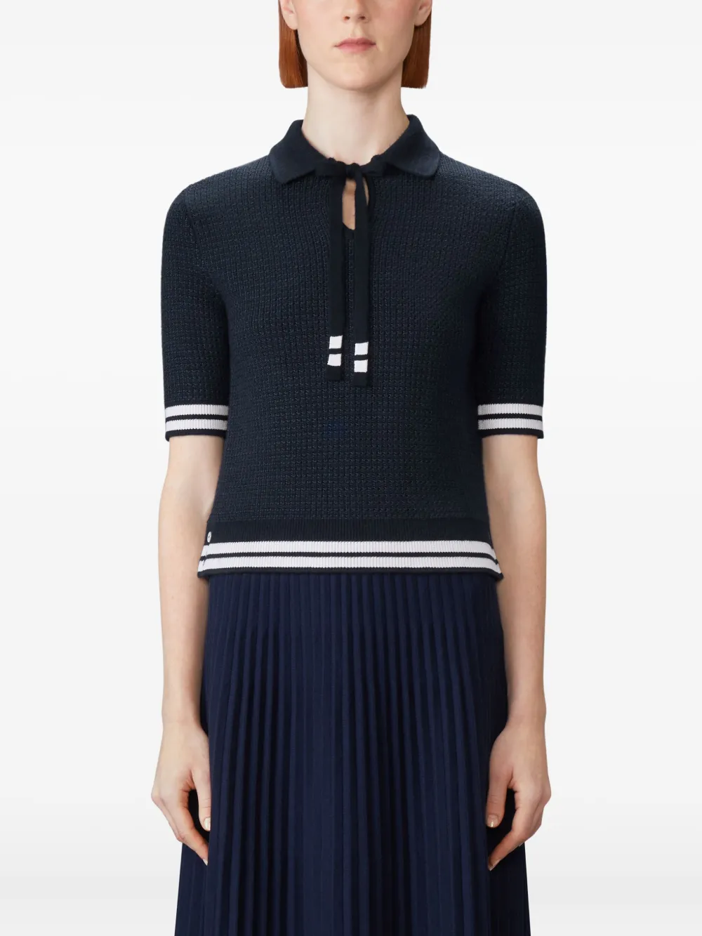 navy t-shirt worn by a person, showing the t-shirt fit