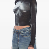 Black top worn by a person, showing the top's fit