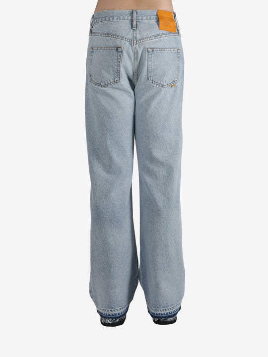 Blue jeans worn by a person, showing the jeans's fit