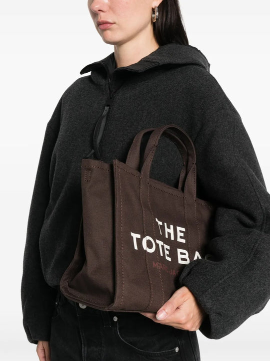 Brown bag, carried by a person, showing the bag's size