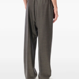 Grey pants worn by a person, showing the pants fit