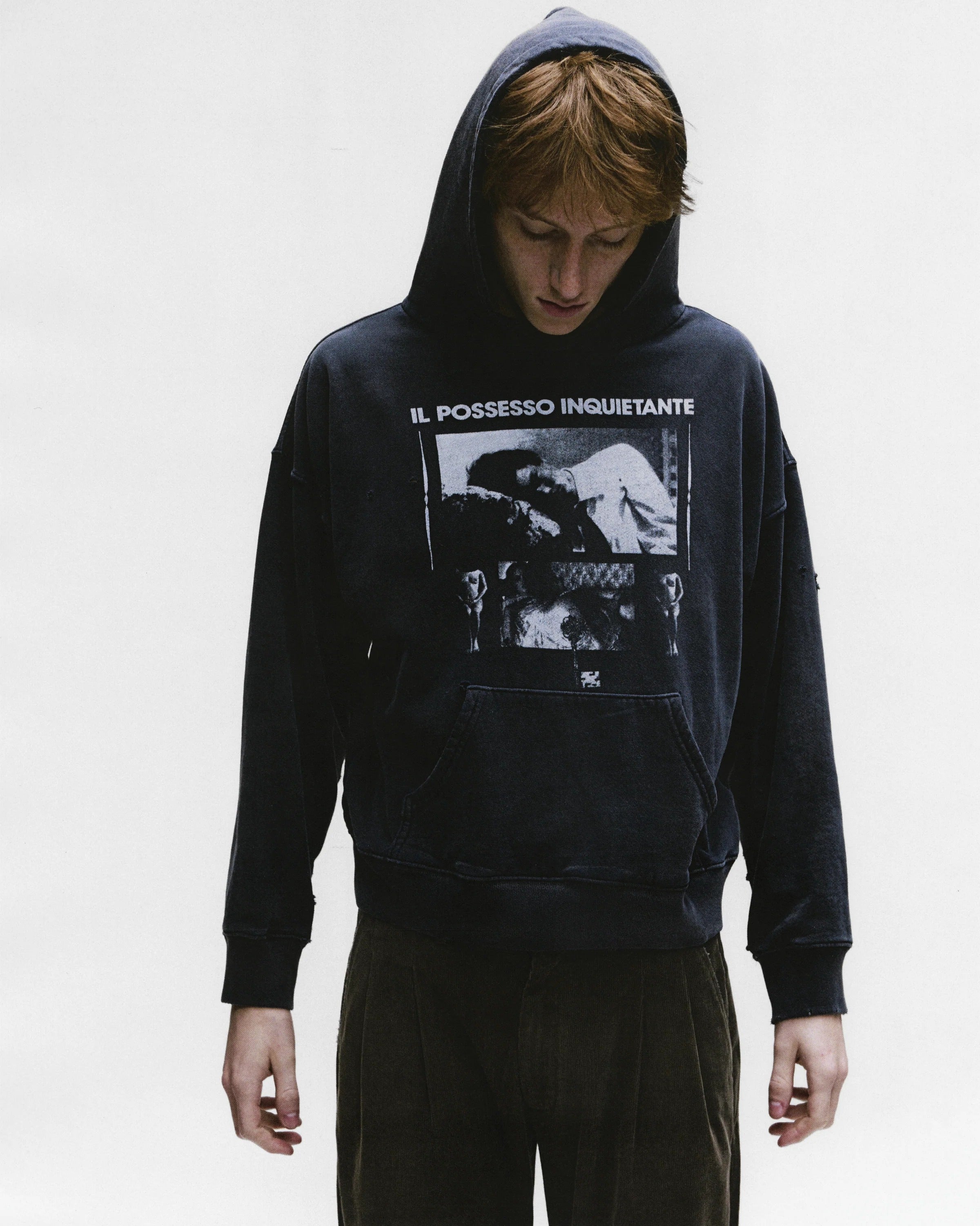 Black hoodies worn by a person, showing the hoodies fit