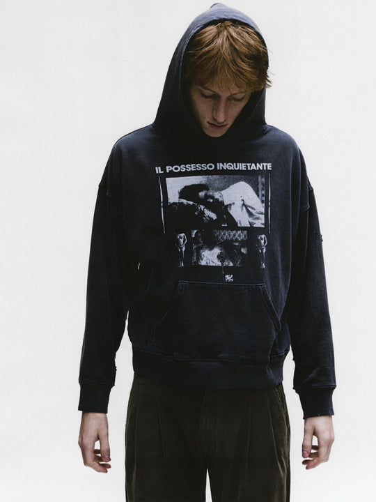 Black hoodies worn by a person, showing the hoodies fit