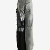 Grey jeans worn by a person, showing the jeans's fit