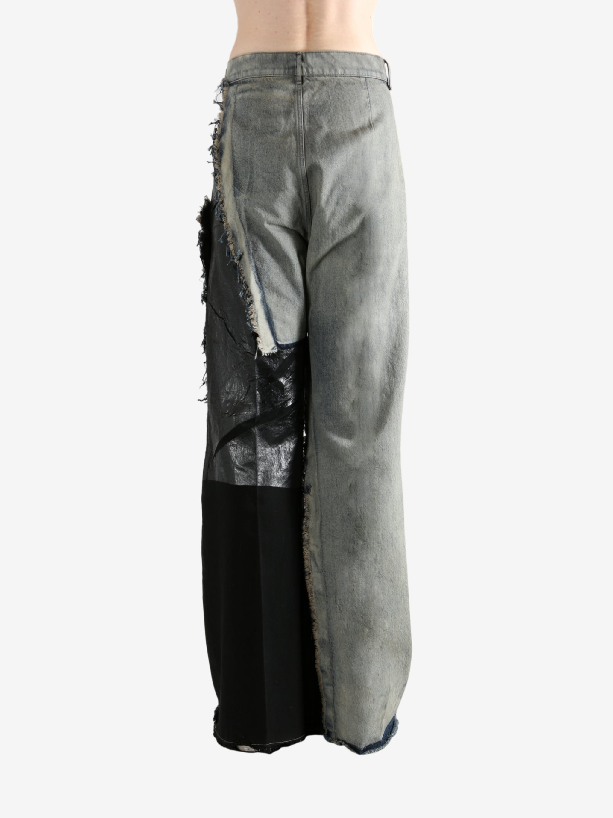 Grey jeans worn by a person, showing the jeans's fit