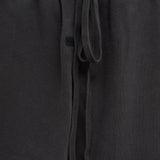 Close up of the grey pants, showing texture of the cotton fabric