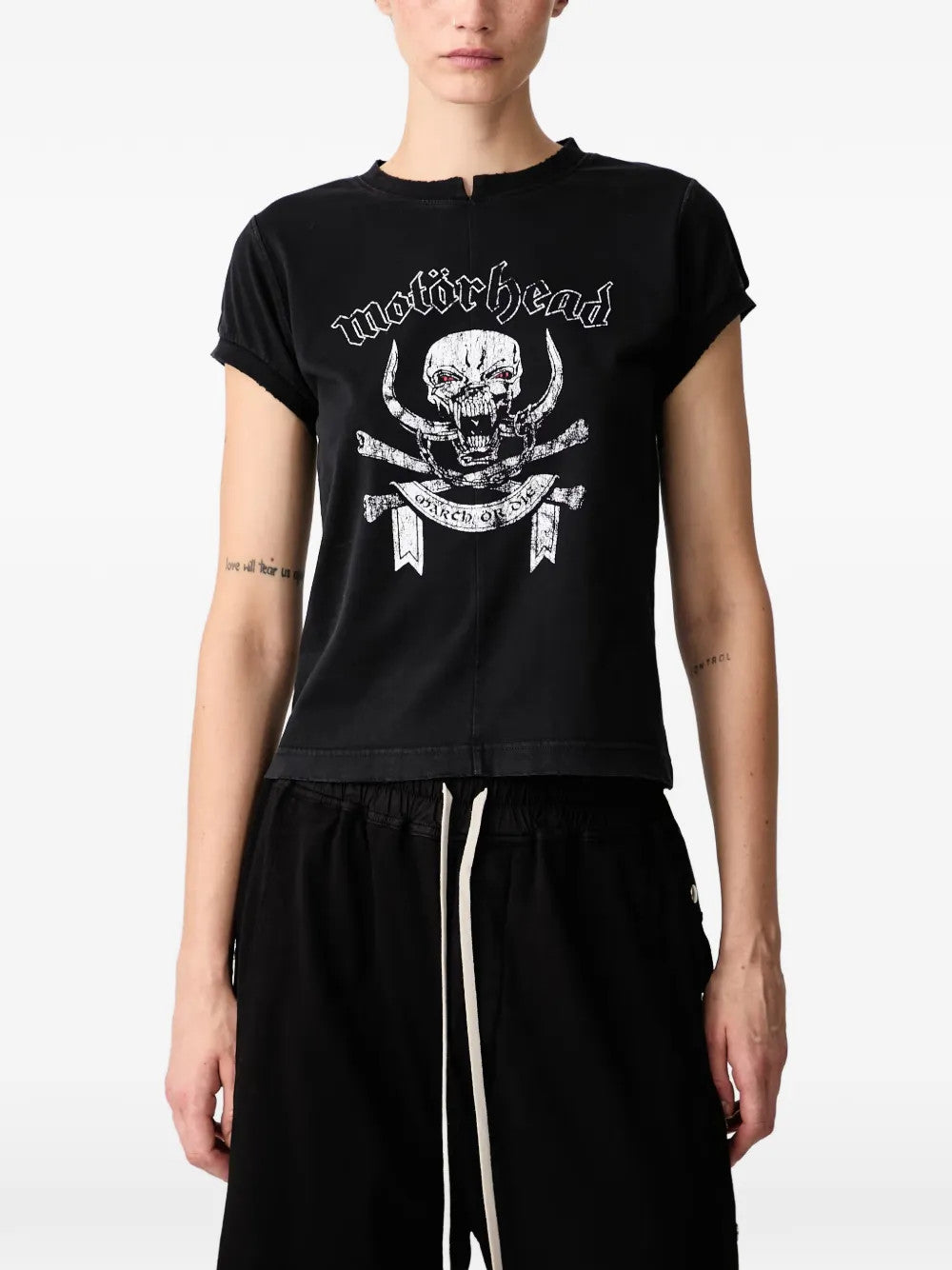 Black t-shirt worn by a person, showing the t-shirt fit