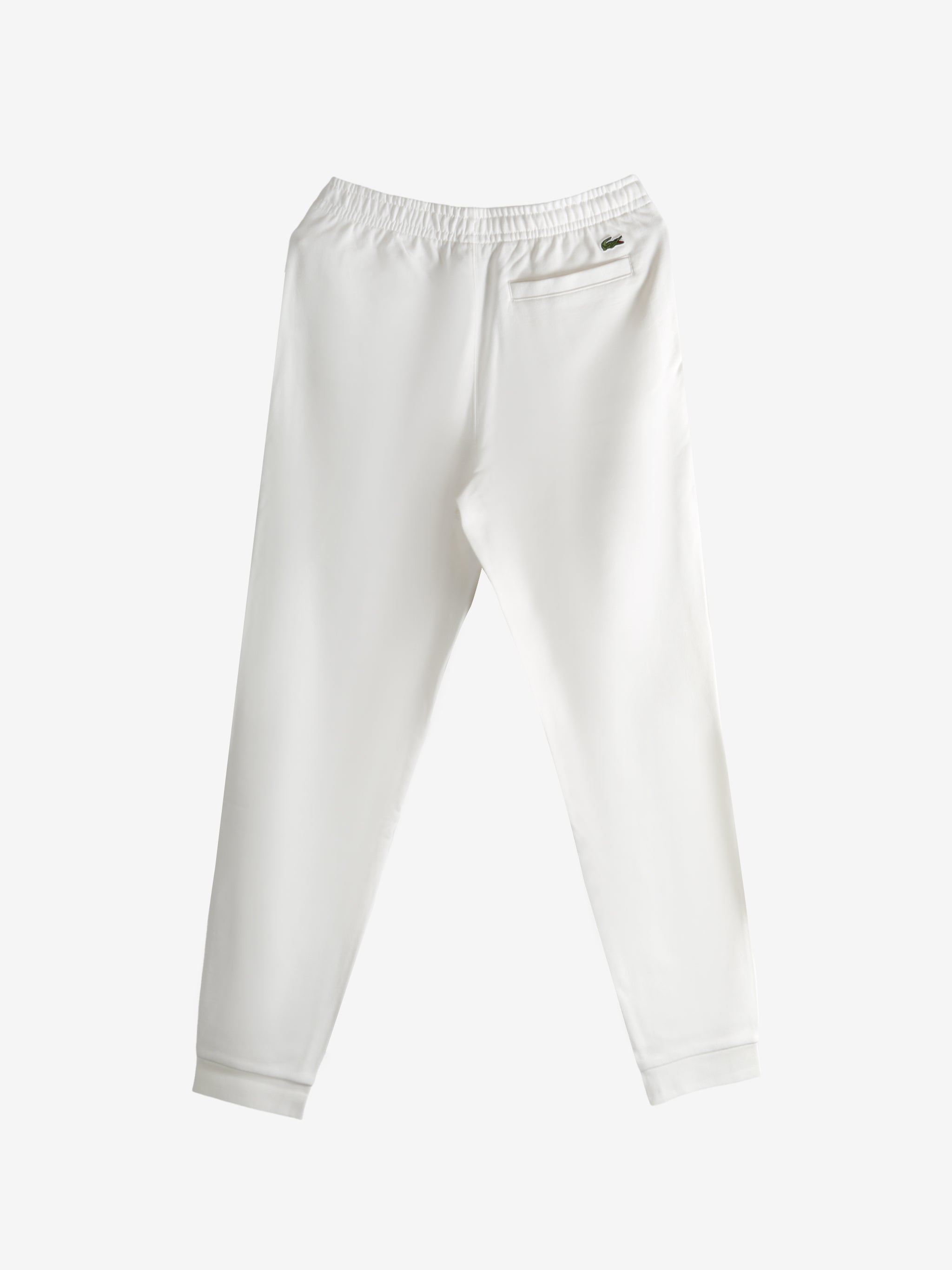 White pants, back view showing tapered fit