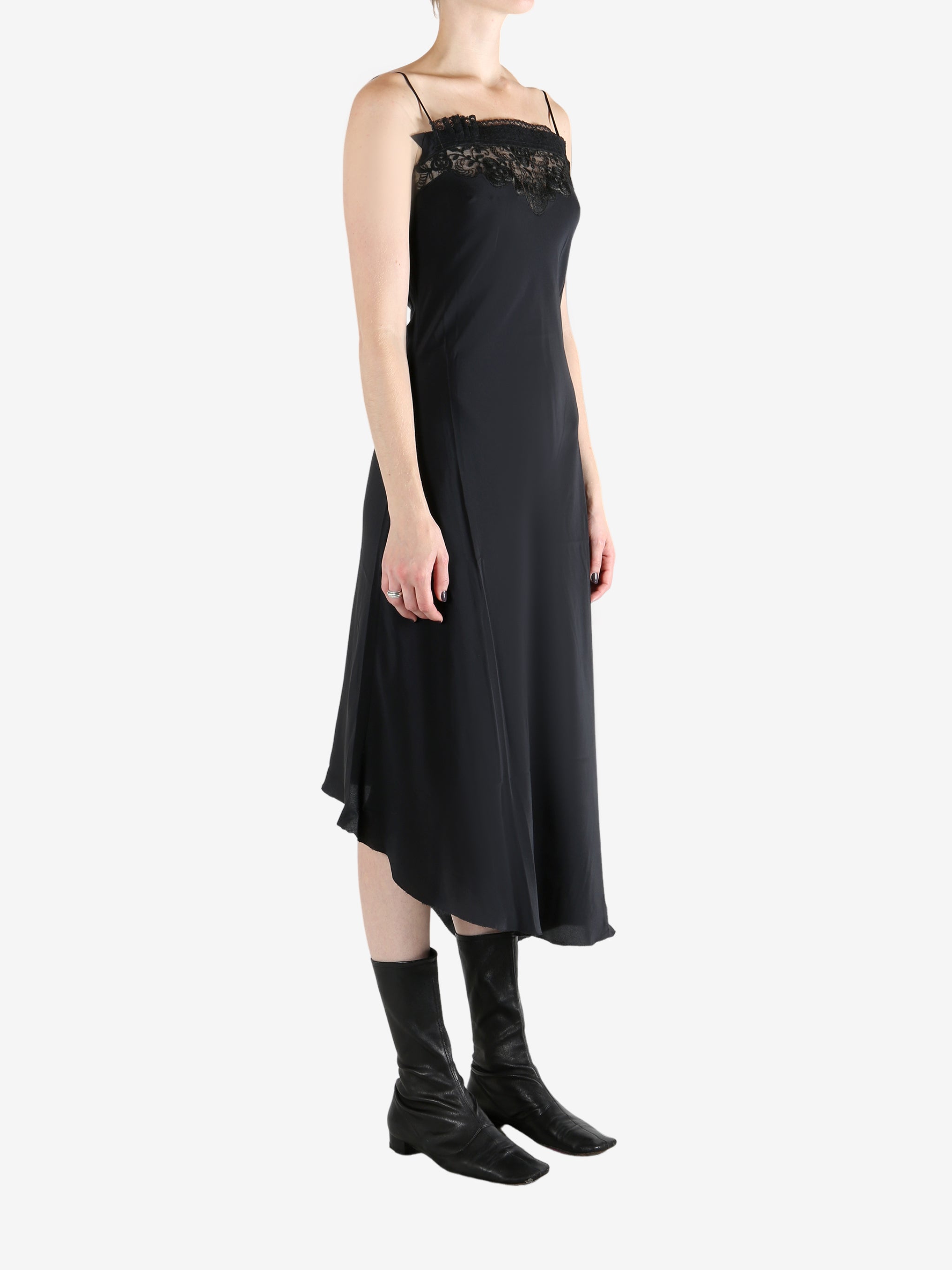 Black dress worn by a person, showing the dress's fit
