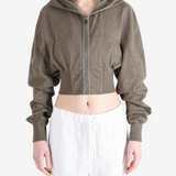 Brown hoodie worn by a person, showing the hoodie fit