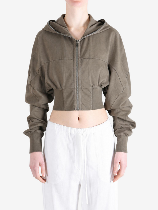 Brown hoodie worn by a person, showing the hoodie fit