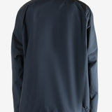 Navy jacket worn by a person, showing the jacket's fit