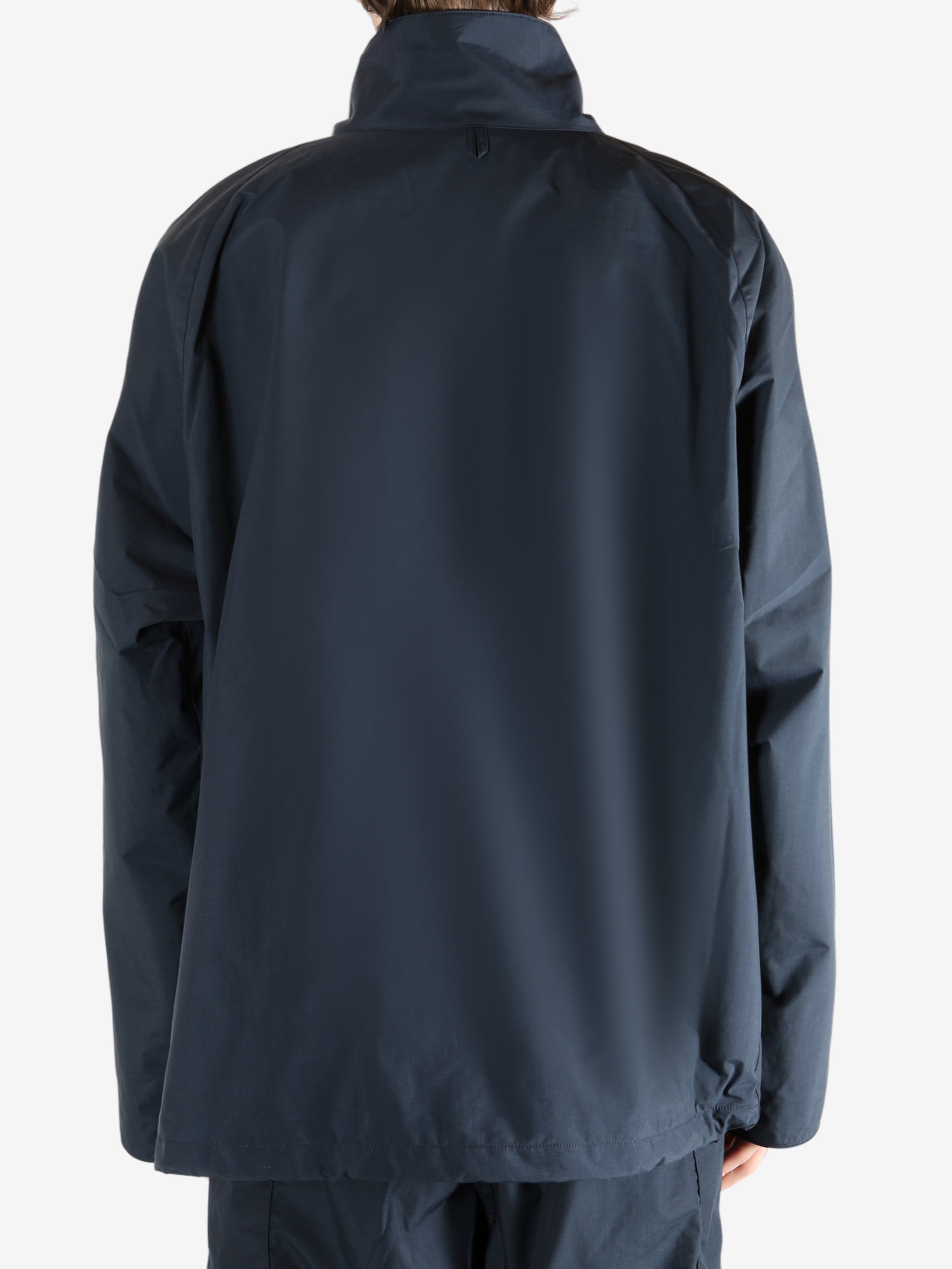 Navy jacket worn by a person, showing the jacket's fit