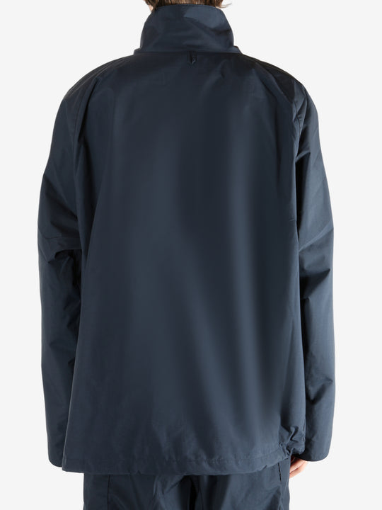 Navy jacket worn by a person, showing the jacket's fit