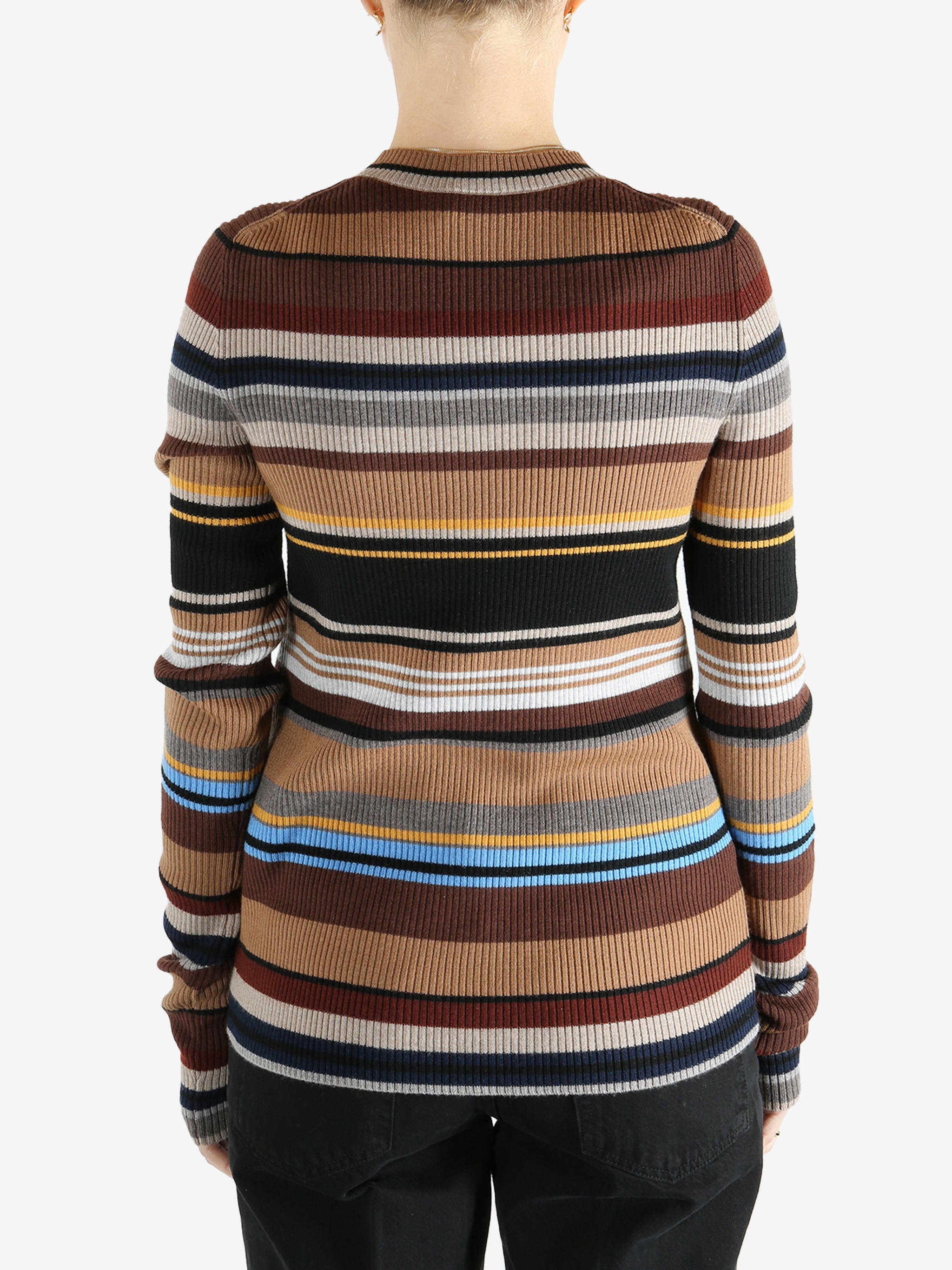 Brown sweater worn by a person, showing the sweater fit