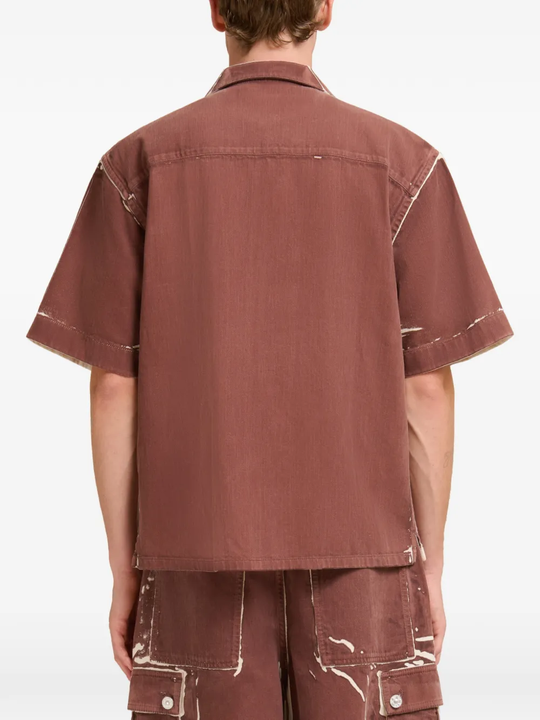 Brown shirt worn by a person, showing the shirt fit