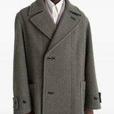 Grey coat worn by a person, showing the coat's fit