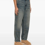 Blue jeans worn by a person, showing the jeans' fit