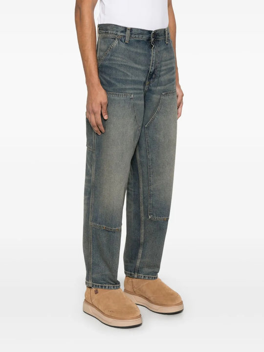 Blue jeans worn by a person, showing the jeans' fit