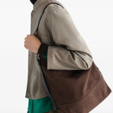 Brown bag worn by a person, showing the bag fit