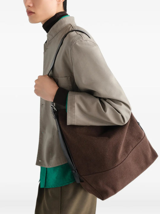 Brown bag worn by a person, showing the bag fit