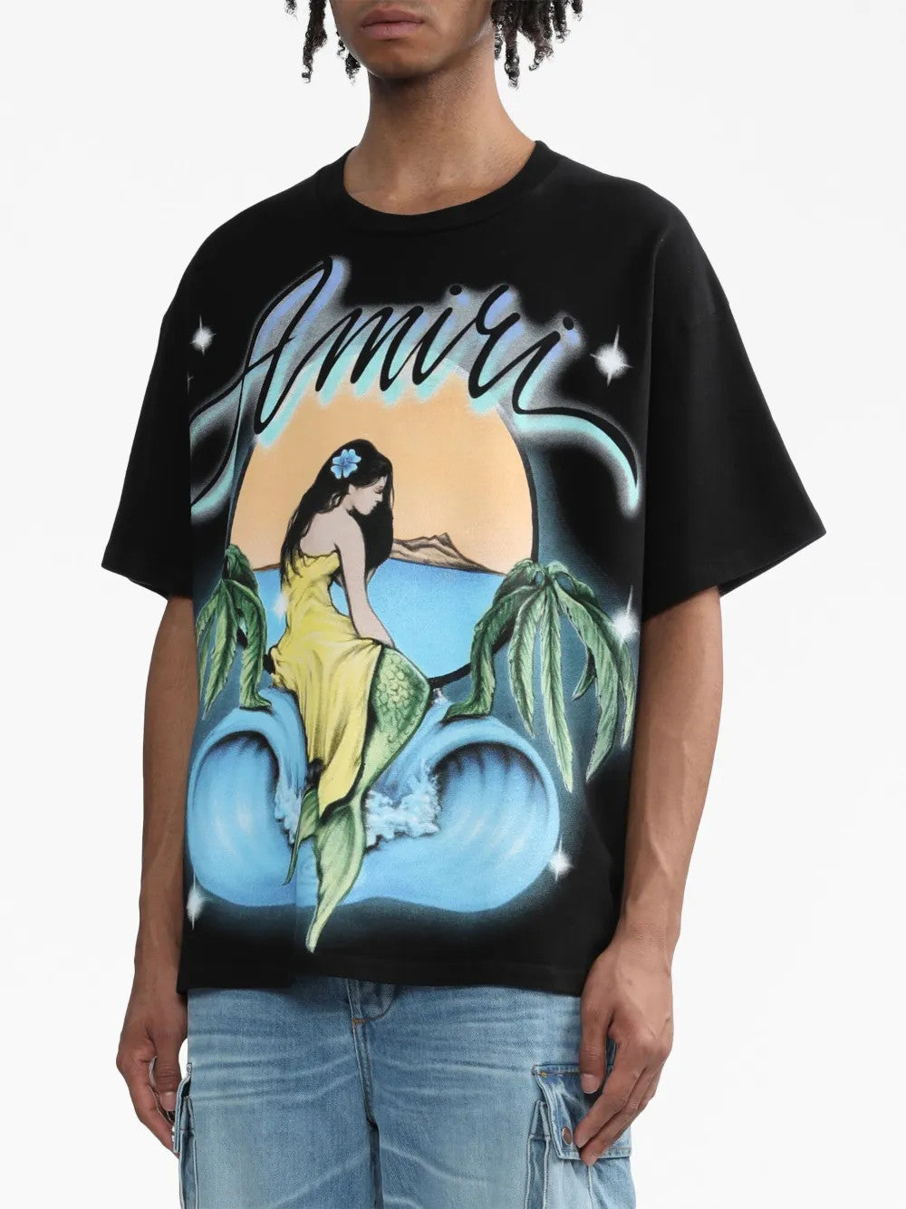 Black t-shirt worn by a person, showing the t-shirt fit