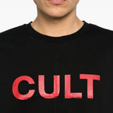 Black t-shirt worn by a person, showing the t-shirt fit