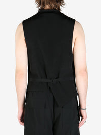 Black vest worn by a person, showing the vest fit