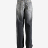 Black jeans worn by a person, showing the jeans' fit