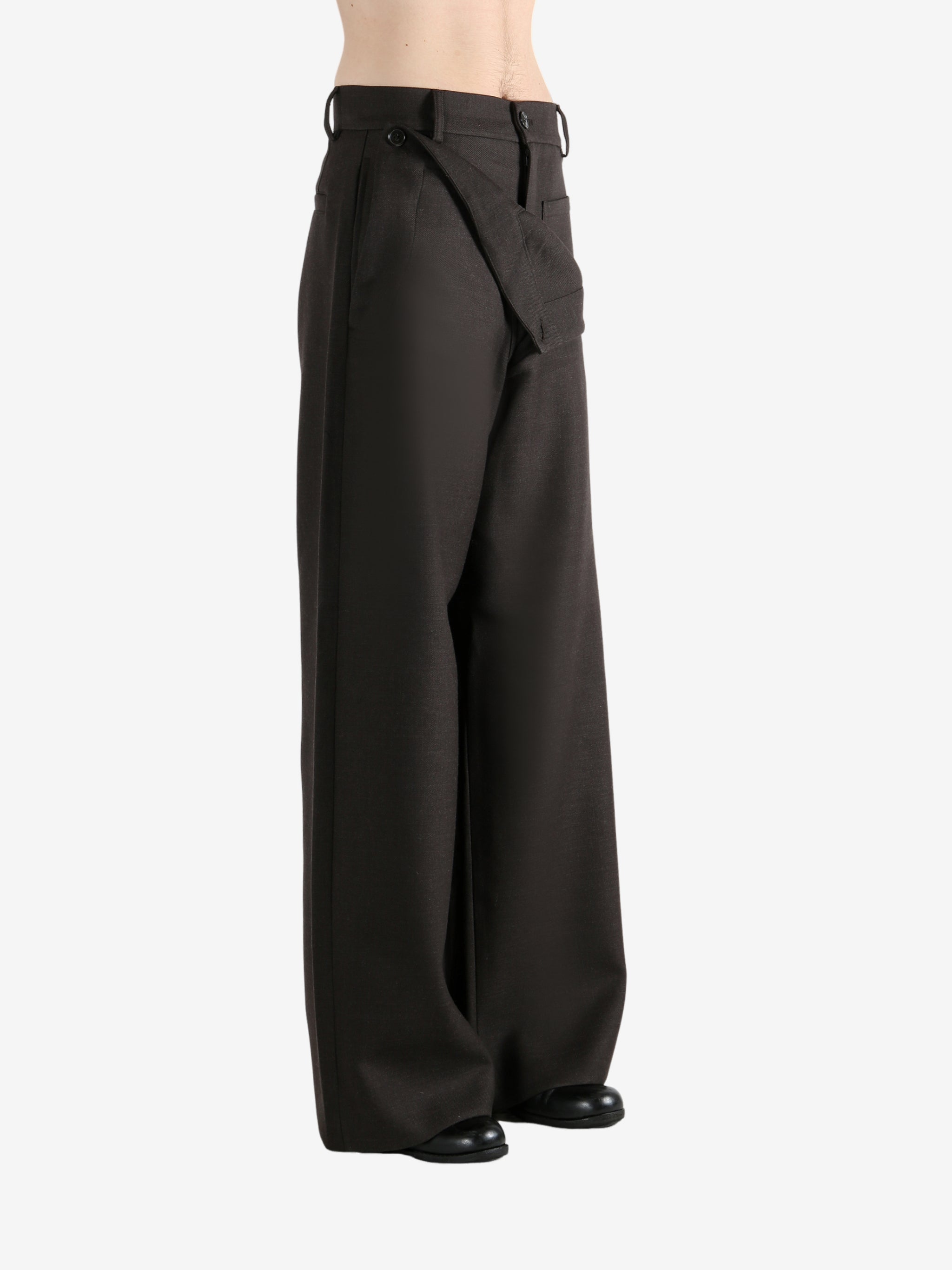 Brown pants worn by a person, showing the pants fit