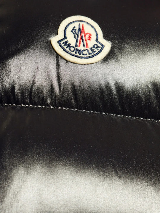 Close up of Black jacket, showing texture of the 100% polyamide fabric