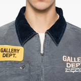 Close up of blue jacket, showing texture of the cotton fabric