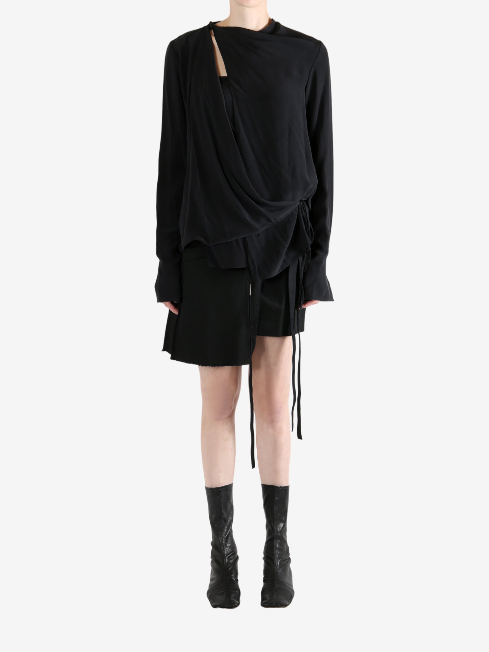 Black top worn by a person, showing the top's fit